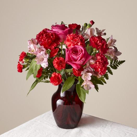 Let your special someone know how you feel with this elegant bouquet. Two colors of roses, carnations & more flowers make a bold statement of your love for Valentine's Day. standard size