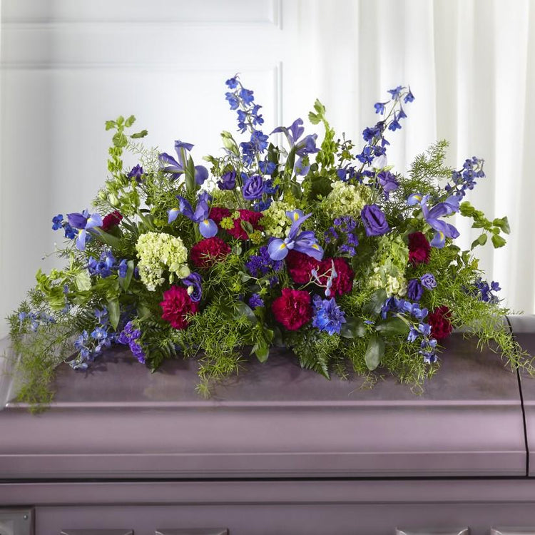 display of wildflowers. Our designers uniquely craft hydrangea, lisianthus, Bells of Ireland and iris to honor a loved one.